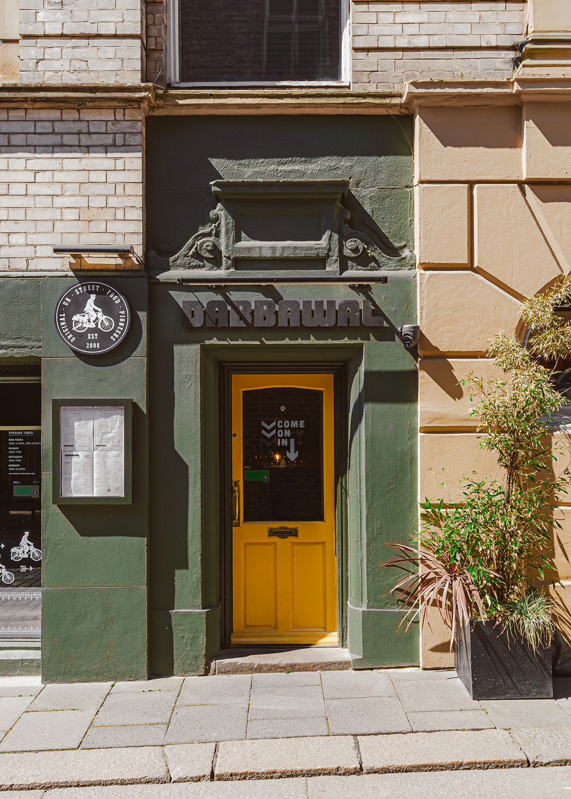 Dabbawal Highbridge exterior facade, pop of colour yellow door