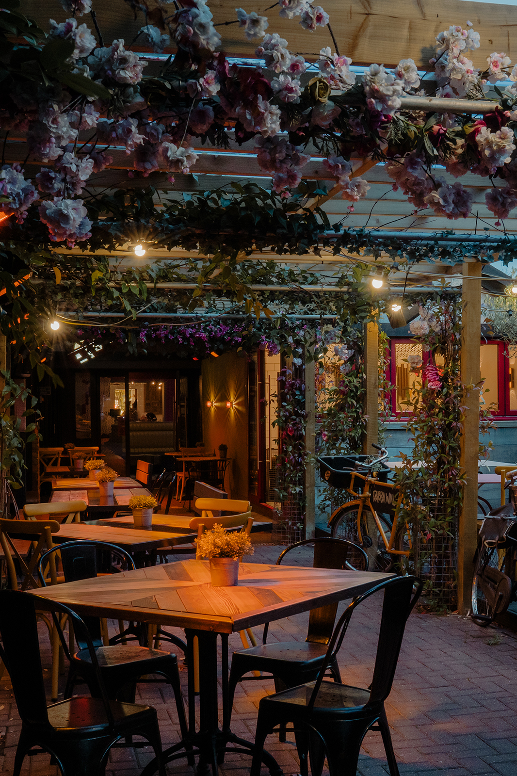 Dabbawal Indian restaurant outdoor heated dining space, floral garden vibe